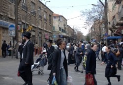 Mea Shearim is a head's street. Jews welt in Israel. Ortodox man, end woman living  in Mea Shearim ultraortodox jews quarter.