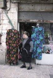 The Time stop is in Mea Searim. 
 Aged woman stands on the street