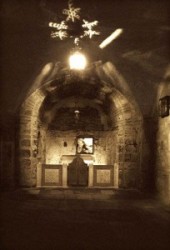 One can see the altar in the Chapel of Adam and the rock beneath the Golgotha. Church of the Holy Sepulchre is in Israel, Jerusalem old sity, Christian Quarter.